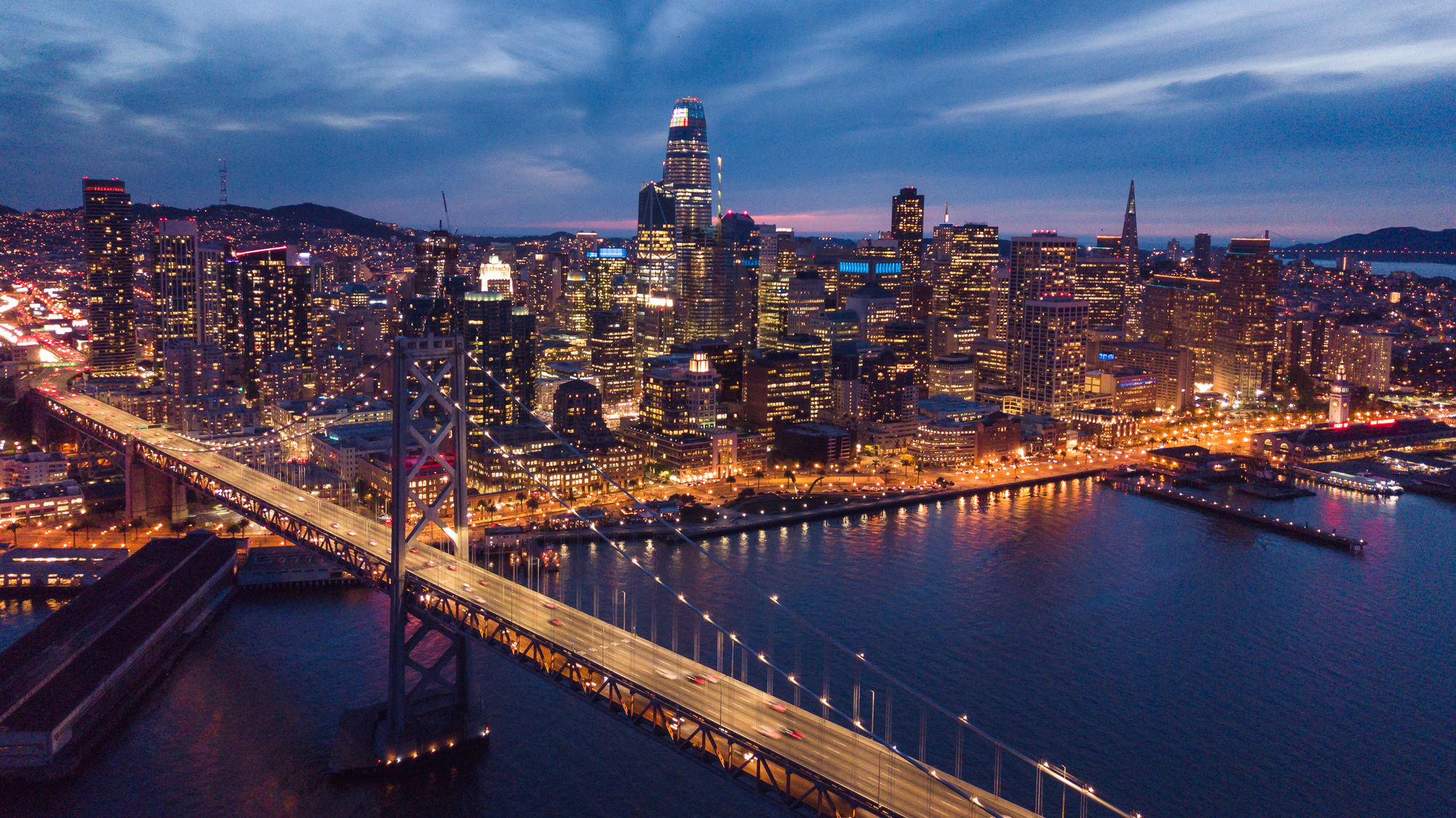 aerial-cityscape-view-of-san-francisco-and-the-bay-bridge-at-night