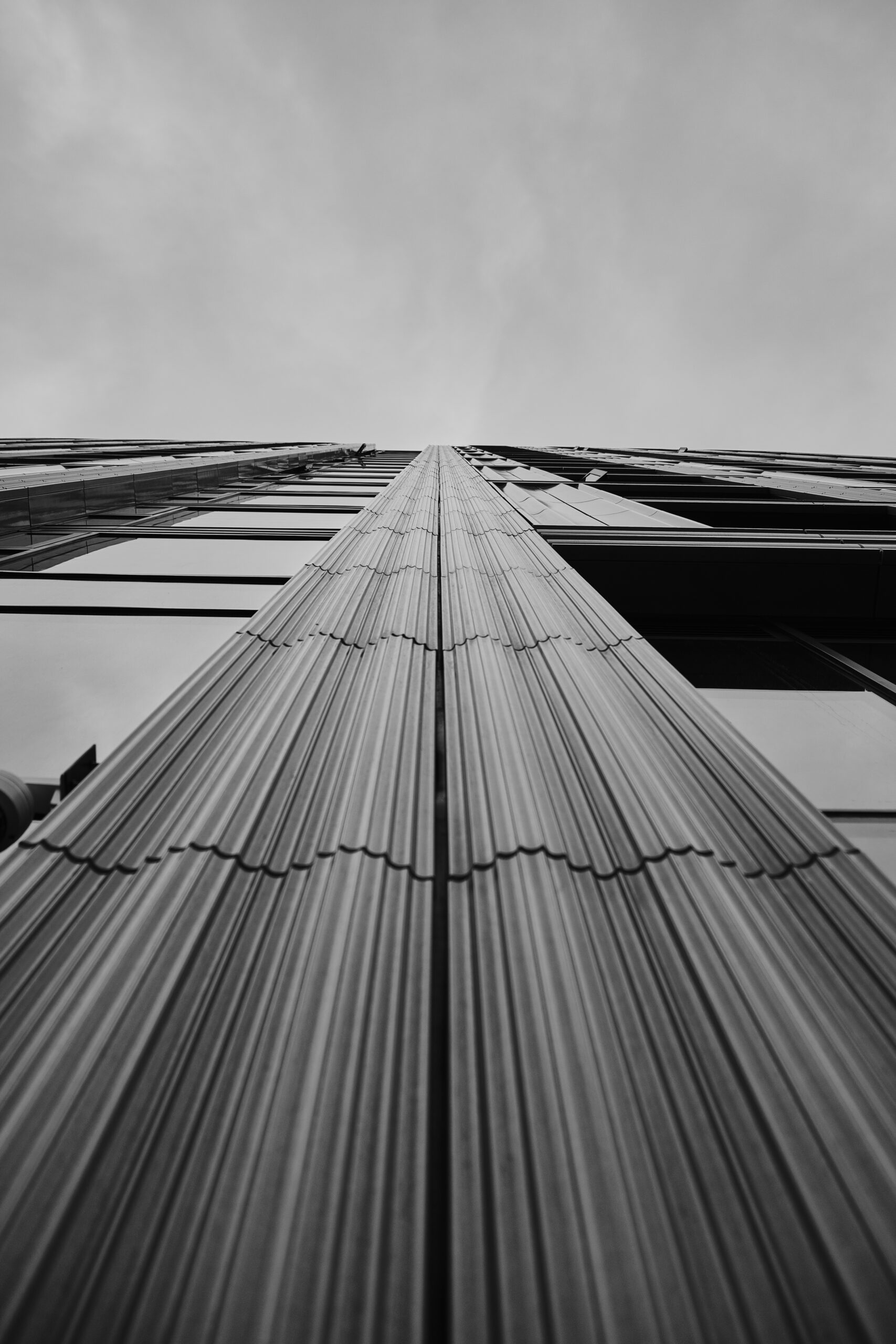 low-angle-greyscale-of-a-modern-skyscraper-under-t-2025-02-11-18-32-37-utc-scaled-1.jpeg