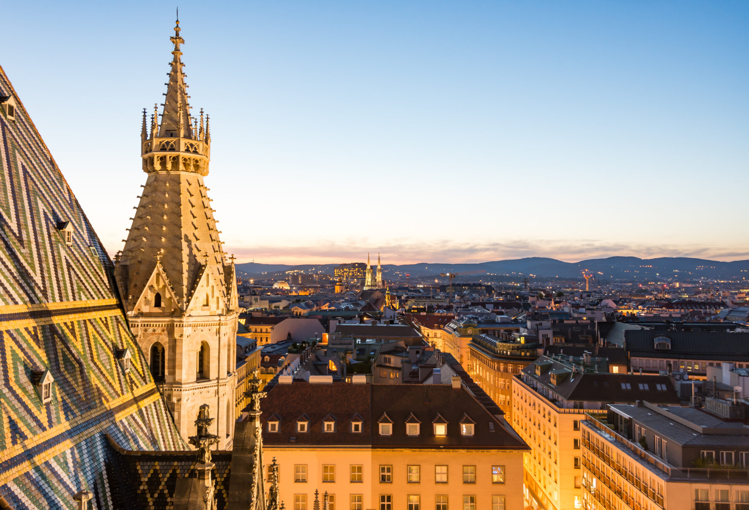 Stephansdom cathedral and aerial view over Vienna (Austria) at night